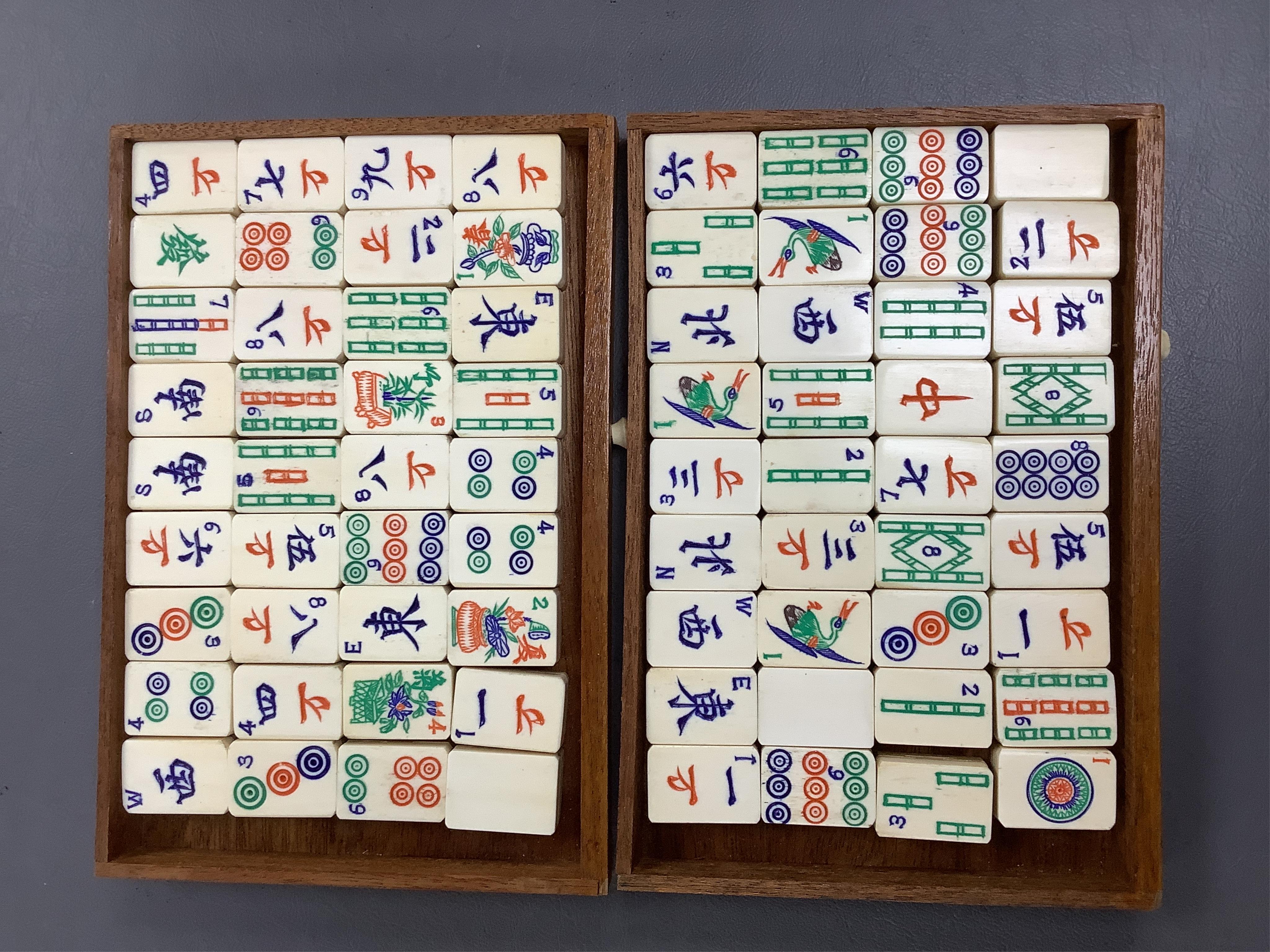 A Chinese carved boxed mahjong set and stands, box 24 cm high including handle